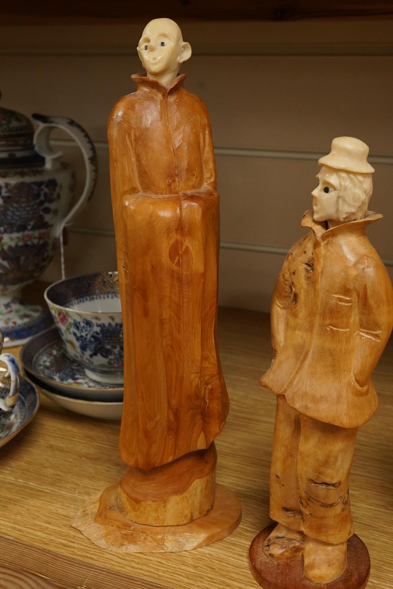 Pierre Decorse (b.1953), a group of four carved figures, tallest 29cm high